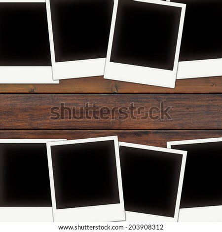 Vintage photo frames on wooden board