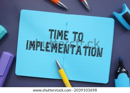 Financial concept about Time To Implementation with sign on the piece of paper. 
