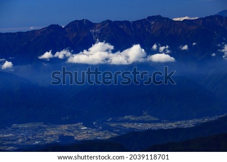 superb view of central alps from the summit of Mt.Shiomi in the Southern Alps,ina city,nagano prefecture,japan. Royalty-Free Stock Photo #2039118701