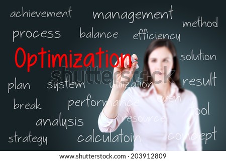 Young business woman writing optimization concept. Blue background. 