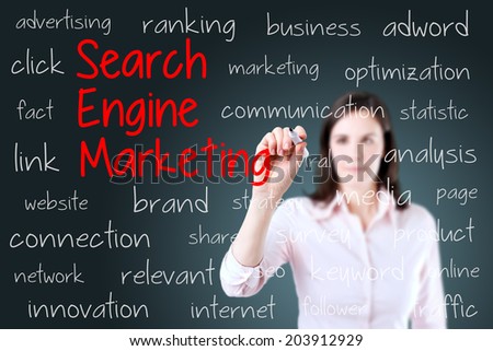 Young business woman writing search engine marketing concept. Blue background.