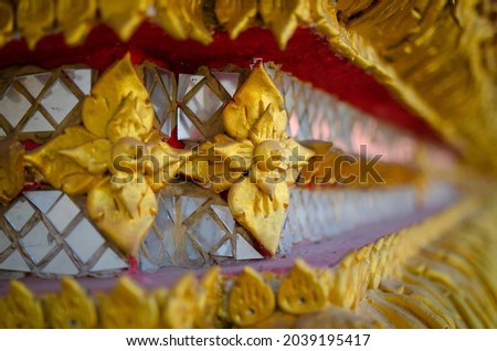 Selective Focus view of Special Cultural - Traditional Golden Flowery Symbol Pattern of Thai Temple. Thailand.