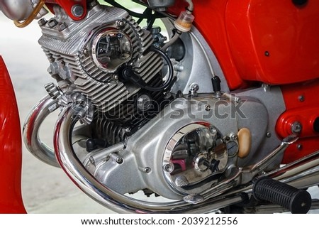 close up picture of old 60s twin cylinder air cooled 
street motorcycle engine with clean chromium
