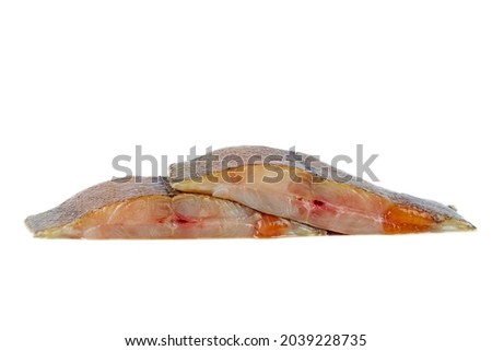 Two pieces of raw flatfish with caviar on a white background