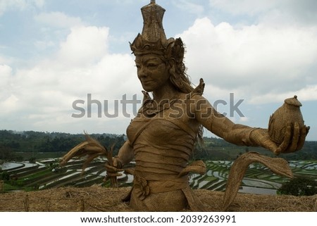 statue of Dewi Sri (Goddess of Fertility) from bamboo, in tourist locations Jatiluwih Rice Terrace, Tabanan Regency, Bali Province, Indonesia. 