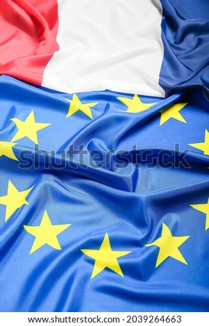 Flags of France and European Union as background, closeup