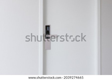 Digital Door locking on white door. panel.