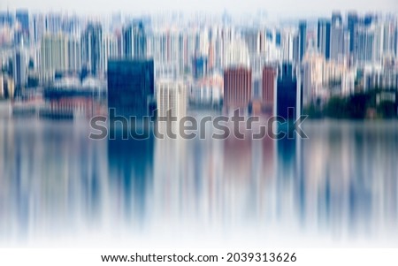 abstract background of blurred skyscrapers at night business and technology concept