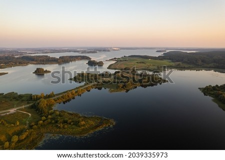 Aerial summer morning sunrise view in sunny Elektrenai lake Royalty-Free Stock Photo #2039335973