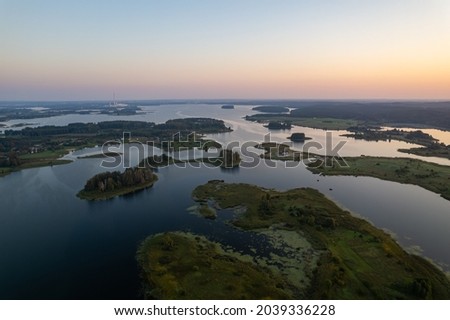 Aerial summer morning sunrise view in sunny Elektrenai lake Royalty-Free Stock Photo #2039336228