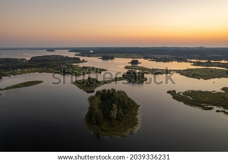 Aerial summer morning sunrise view in sunny Elektrenai lake Royalty-Free Stock Photo #2039336231