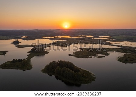 Aerial summer morning sunrise view in sunny Elektrenai lake Royalty-Free Stock Photo #2039336237