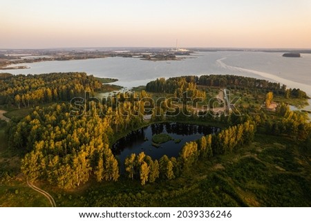 Aerial summer morning sunrise view in sunny Elektrenai lake Royalty-Free Stock Photo #2039336246