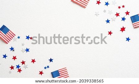 USA holiday banner design. Frame of american flags and confetti stars on white background. Happy Independence day, President's Day, Labor day concept. Royalty-Free Stock Photo #2039338565