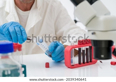 Scientific experiment in the laboratory of biological chemistry.Biochemistry, biophysics, and molecular biology is the study of chemical and physics processes within and relating to living organisms. Royalty-Free Stock Photo #2039340641