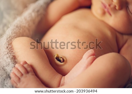 Newborn Baby Boy Sleeping Peacefully with Navel Royalty-Free Stock Photo #203936494