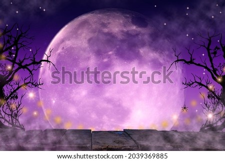 Halloween empty copy space background with full moon, wooden table template for holiday greeting card design, party invitation.