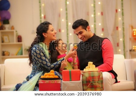Family celebrating diwali at home with full of happiness Royalty-Free Stock Photo #2039376980