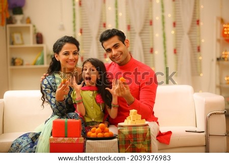 Family celebrating diwali at home with full of happiness Royalty-Free Stock Photo #2039376983