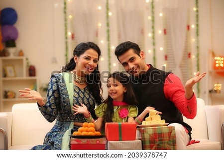 family celebrating diwali at home with full of happiness Royalty-Free Stock Photo #2039378747