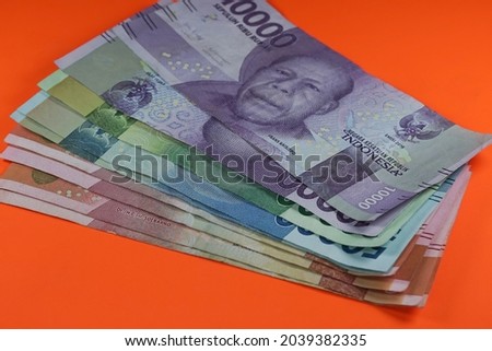 Indonesian Rupiah as legal tender. 540.000 IDR on isolated orange background.  
