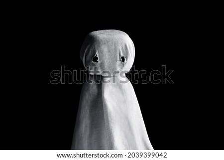 White ghost isolated on black background