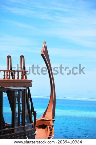 Traditional Maldivian boat and beautiful blue sea, beautiful view at a luxury resort in the Maldives islands