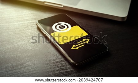 Subscription payment - regular monthly or periodic annual subscription basis fee concept. Mobile smartphone subscription payment with credit bank card and a recurring payment icon for membership users Royalty-Free Stock Photo #2039424707