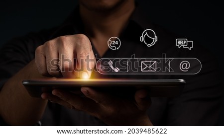 A man points to an operator's symbol, with icons for after-sales services. Communication channel of customer satisfaction. Royalty-Free Stock Photo #2039485622