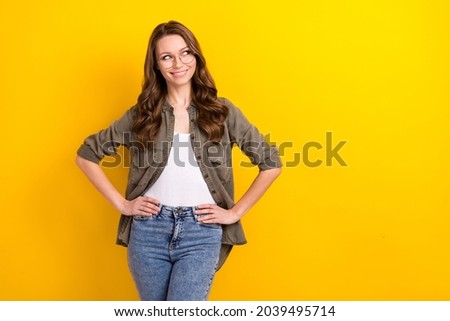 Photo of smart student brunette long hairdo lady look empty space wear shirt spectacles isolated on yellow color background