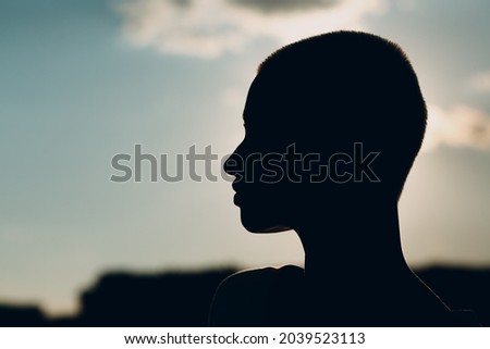 Portrait profile silhouette of young smiling millenial european short haired woman. Beautiful happy blonde girl outdoor. Summer fashion female clothing.