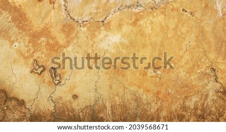 Satellite photo of desert land, aerial top view of Earth topography for abstract texture background. Terrain map with nature pattern, deserted sand landscape. Elements of image furnished by NASA. 