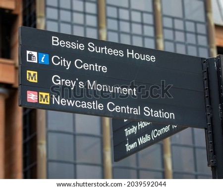 Signposts showing the directions to various landmarks in the city of Newcastle upon Tyne, UK.