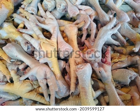 Pile of chicken feet at the traditional market