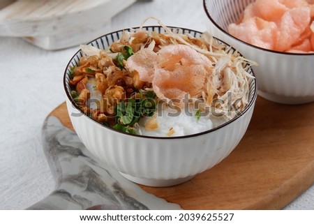Bubur ayam or Indonesian rice porridge served with shredded chicken