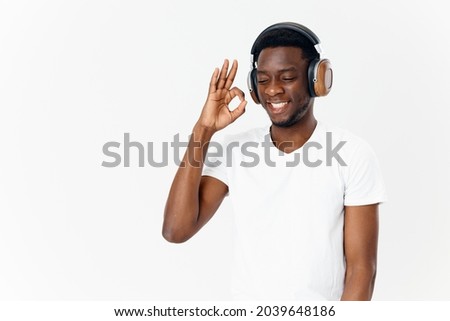 man in headphones pro White t-shirts technology Music lover light background