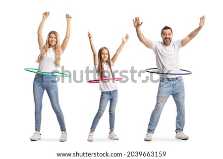 Family of a mother, father and daughter spinning hula hoops isolated on white background Royalty-Free Stock Photo #2039663159
