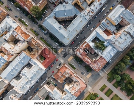 View from above on the crossroads and rusty rooftops of old living houses. Residential district in St Petersburg city center. Russia in the summer. Russian cities. Photo from the top.