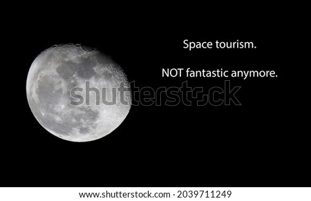 Moon on black background with text. Space tourism not fantastic anymore.