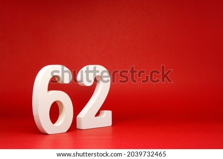 Sixty Two ( 62 ) white number wooden Isolated Red Background with Copy Space - New promotion 62% Percentage   Business finance or birthday Concept - advertise banner picture online with copy space