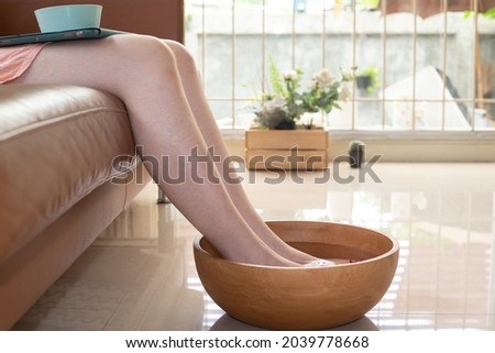 Foot bath in bowl and tropical, spa pedicure treatment,