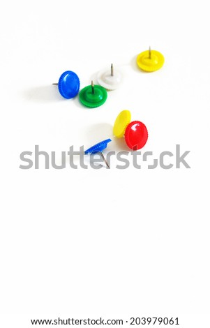 Set of push pins in different colors on white background
