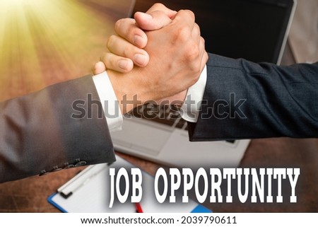 Inspiration showing sign Job Opportunity. Word for an opportunity of employment or the chance to get a job Two Professional Well-Dressed Corporate Businessmen Handshake Indoors