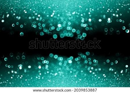Dark black glam teal green glitter sparkle confetti background for turquoise happy birthday party invite, aqua mint color sequin banner, celebrate bridal gala bokeh lights, or Christmas xmas sale ad Royalty-Free Stock Photo #2039853887