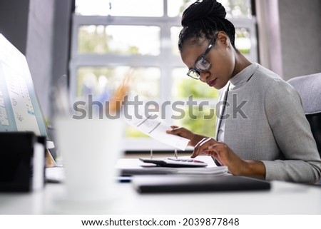African American Accountant Or Auditor With Calculator Royalty-Free Stock Photo #2039877848