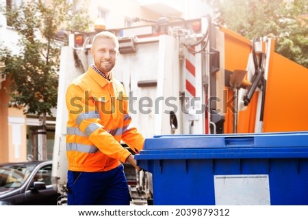Garbage Removal Man Doing Trash And Rubbish Collection Royalty-Free Stock Photo #2039879312