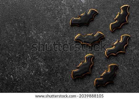 gingerbread bat halloween on dark stone background copy space