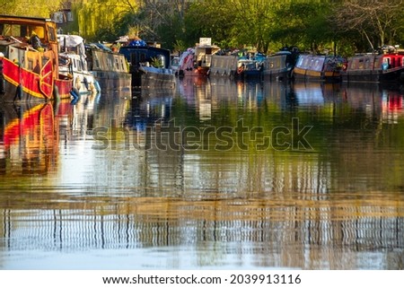 London, UK, 2020: A sunny day in Hackney during Lockdown along the river Lee with clear water Royalty-Free Stock Photo #2039913116