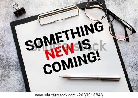 Something new is coming. Business concept. text on white notepad paper