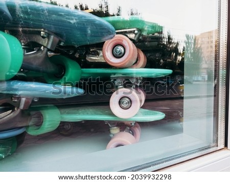 New chip plastic pennyboard skateboards exposed in store window